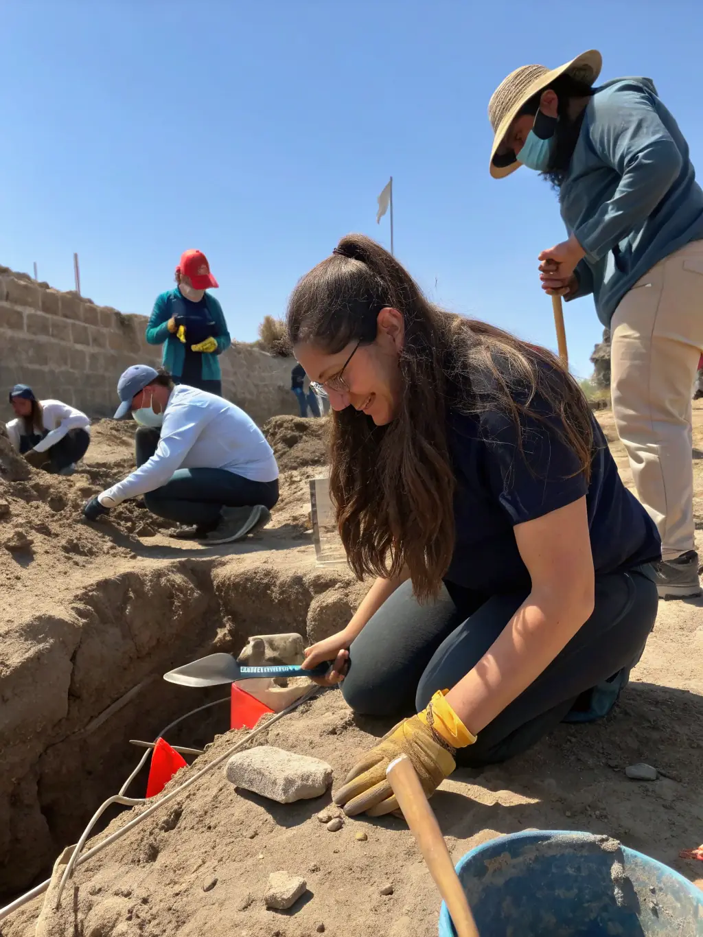 A photograph of a public outreach event where UAEVGM archaeologists are presenting their findings to the local community, promoting awareness and appreciation of local history.